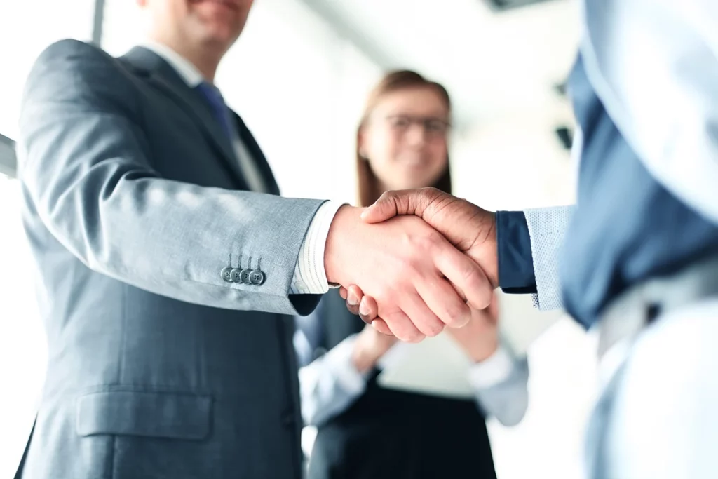 Professionals Shaking Hands in the office